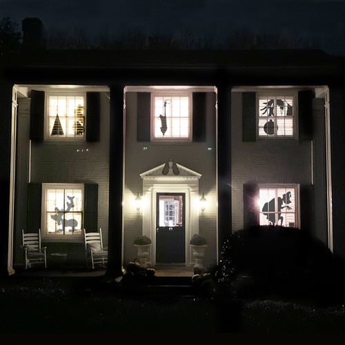 House at night with lit windows