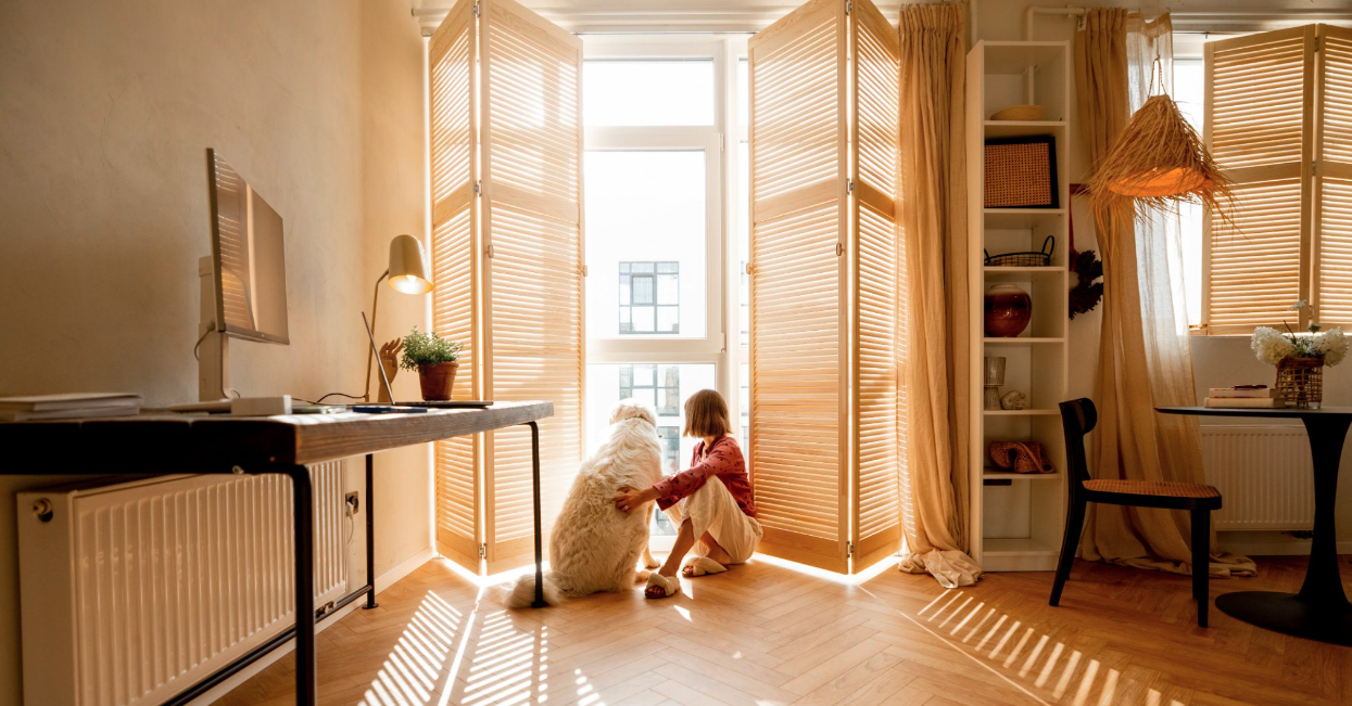 Dog and owner in window opening